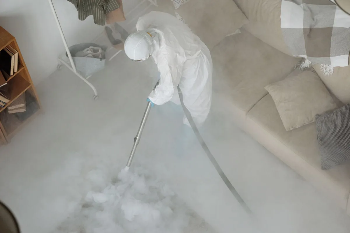 Biohazard cleanup technician in protective equipment, Springville, UT